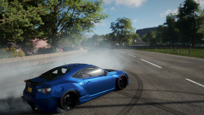 Blue car drifting on a road in Forza Horizon 4