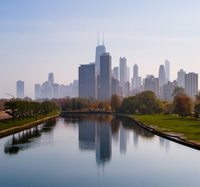 Chicago skyline with John Hancock Tower reflected in river