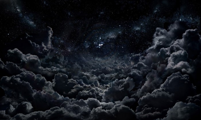 Dark night sky with stars and clouds