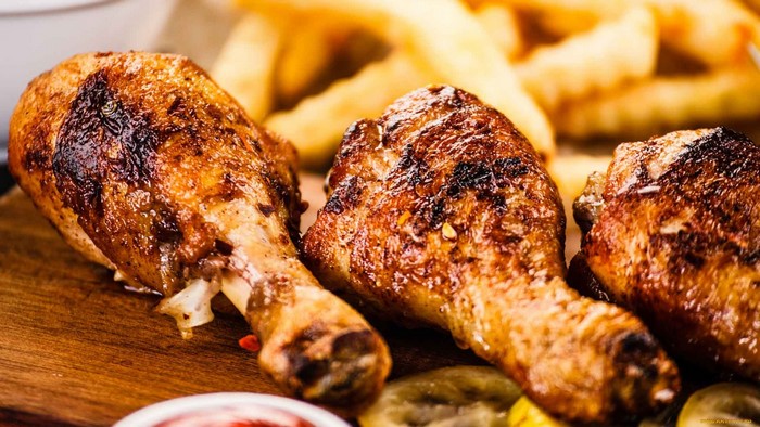 Roasted chicken legs with french fries