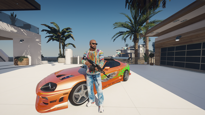 Man with gun and orange car in Grand Theft Auto V