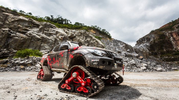 Mitsubishi Triton Survivor with tracks in quarry