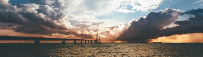 The Great Belt Bridge panorama with storm clouds and ship
