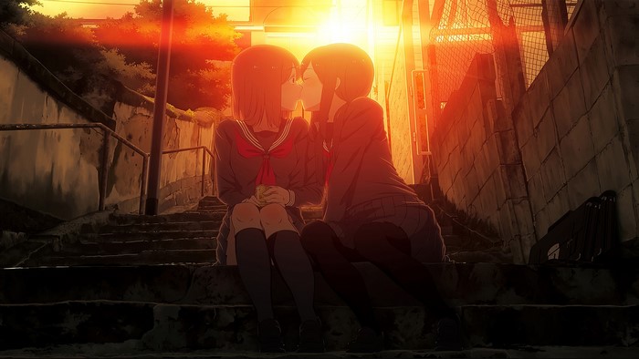 Two anime girls in school uniforms kissing at sunset