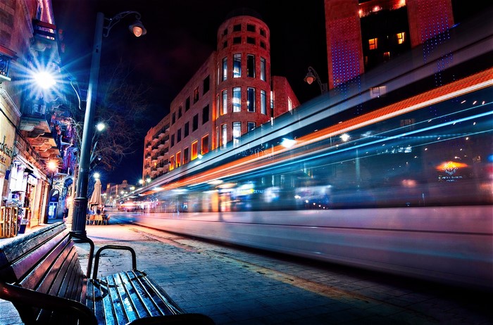 City street at night with tram motion blur