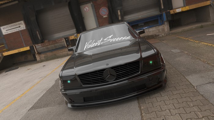 Black Mercedes-Benz with "Violent Success" banner