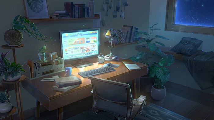 Desk with computer, plants, and window view