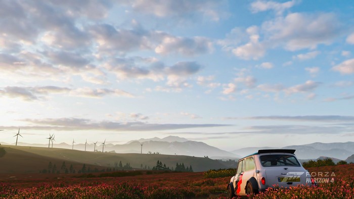 Mini Cooper in a field with windmills and mountains, Forza Horizon 4