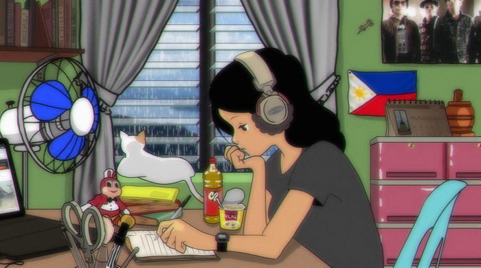 Girl with headphones studying at a desk in the Philippines