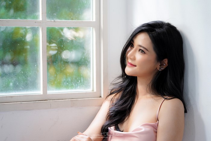 Asian Model with Black Hair Posing by Window