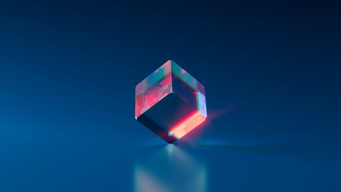 Crystal cube with refraction on blue background