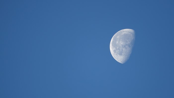 Half Moon in a Blue Sky
