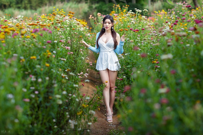 Asian Woman Wearing White Dress in Flower Field 4K