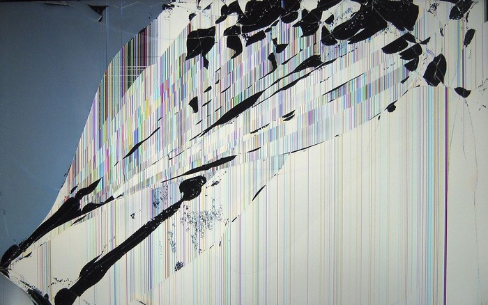 Broken LCD monitor screen with colorful lines