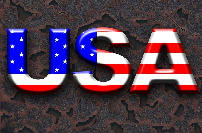 USA text with American flag design on rusty background