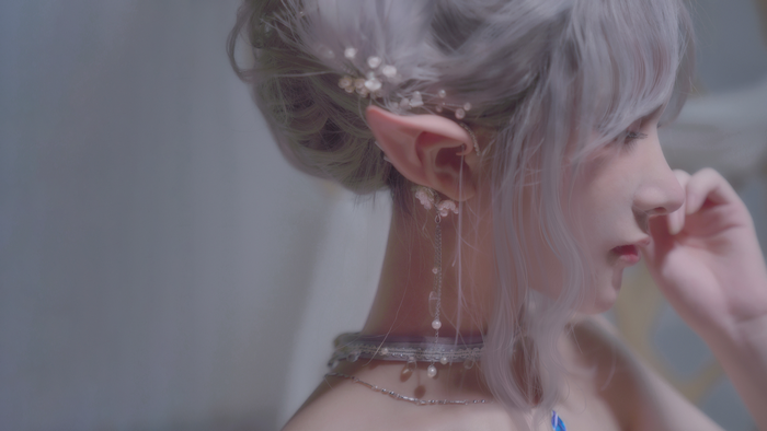 Woman with elf ears and silver hair