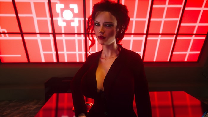 Woman in black suit in front of red grid screen