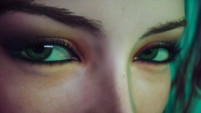 Close-up of a woman's green eyes