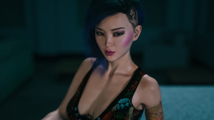 Woman with blue hair and tattoos in City of Broken Dreamers