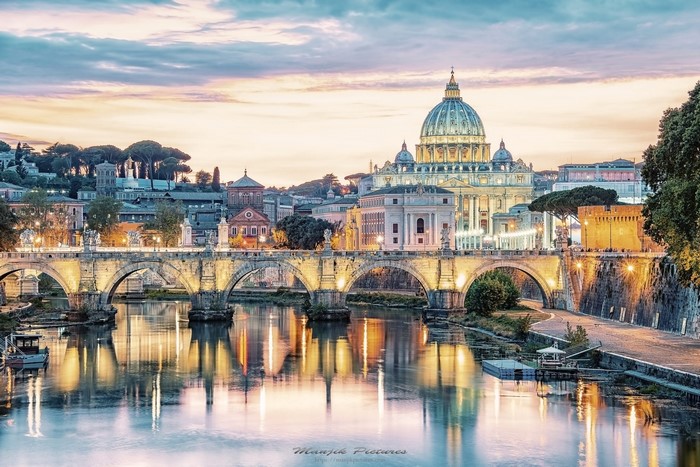 St. Peter's Basilica and Ponte Sant'Angelo over Tiber River in Rome, Italy