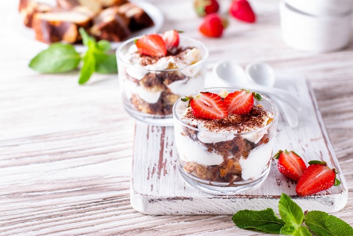Tiramisu desserts with strawberries and mint