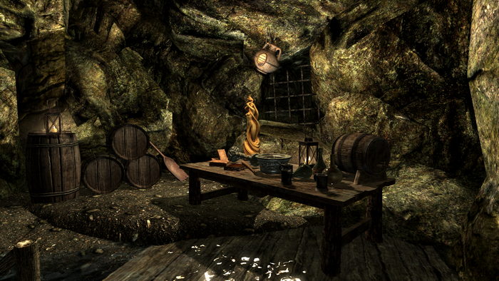 The Elder Scrolls V: Skyrim cave interior with alchemy table