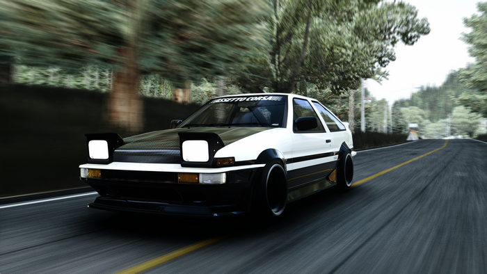 Toyota Corolla AE86 drifting on a road