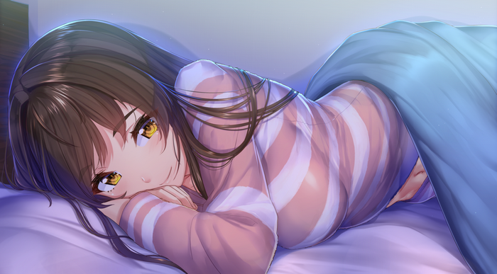 Girl in bed with striped pajamas