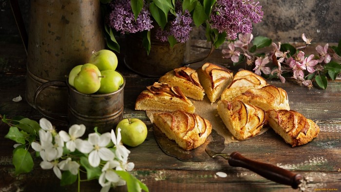Apple cake with fresh apples and lilac flowers