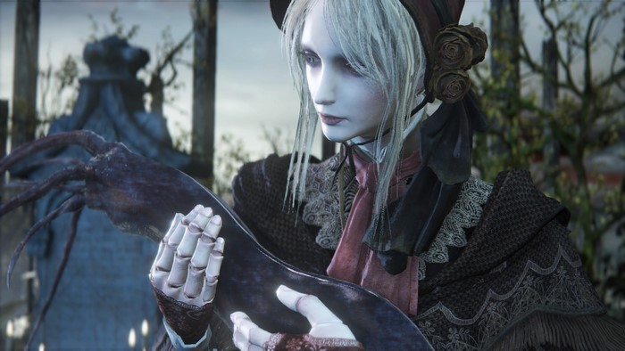 Bloodborne screenshot of a pale woman holding a creature