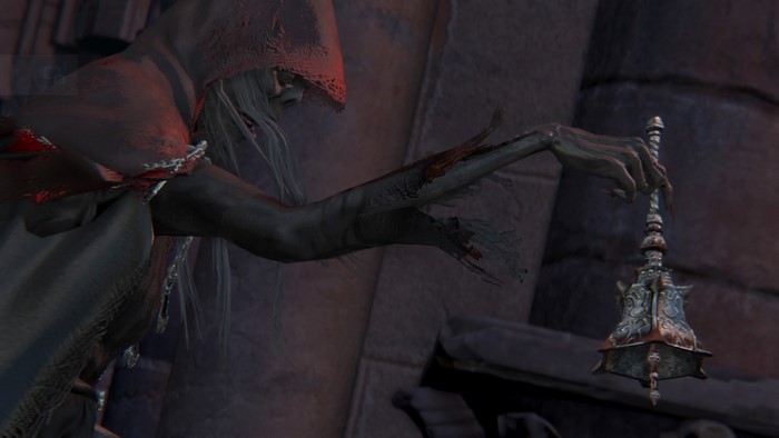 Character from Bloodborne holding a weapon