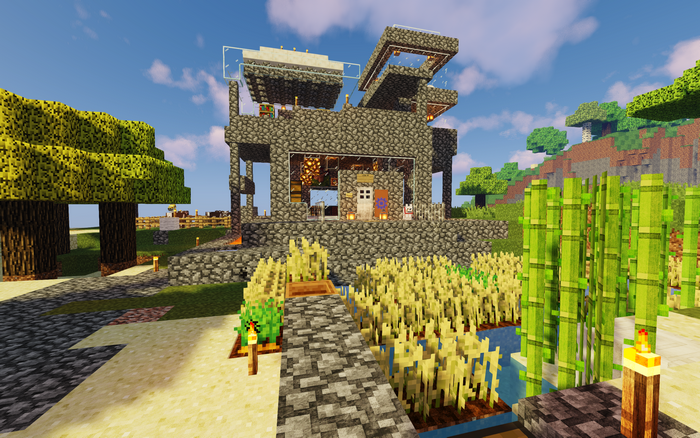 Minecraft stone house with crops and trees