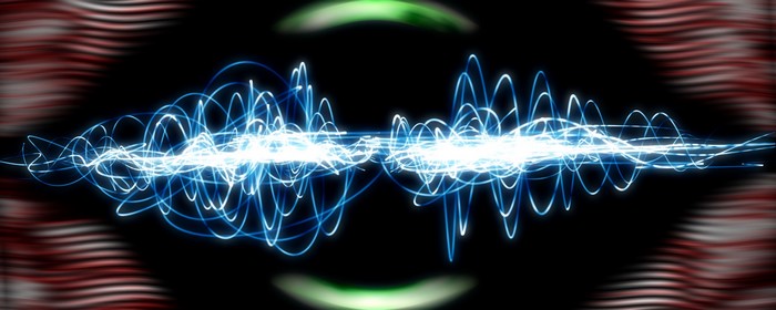 Abstract blue waveforms on black background