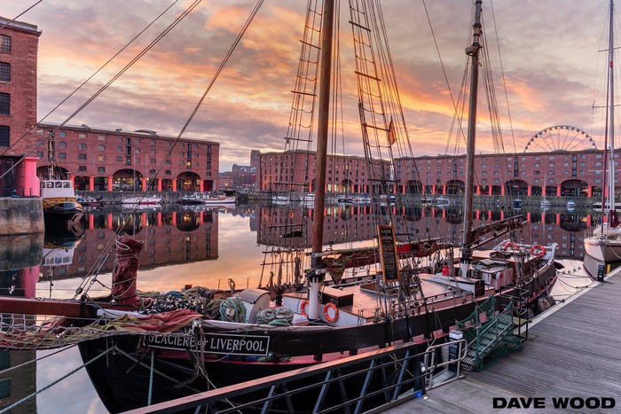 Albert Dock, Liverpool, England with a boat at sunset