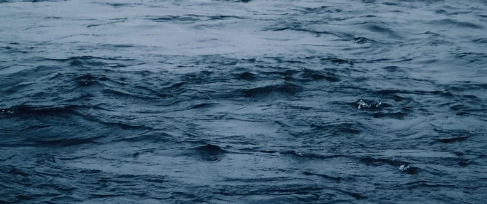 Dark blue water with ripples