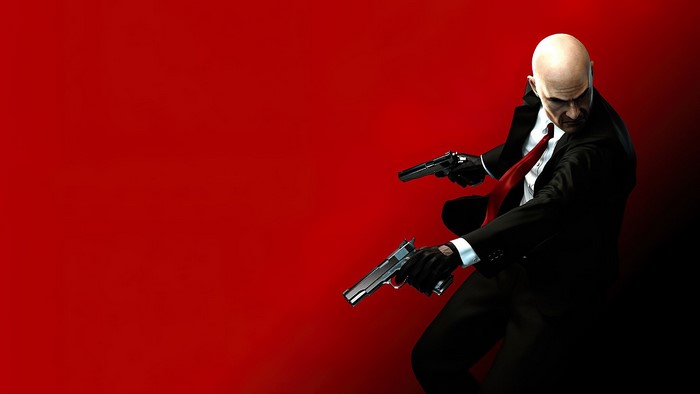 Agent 47 from Hitman holding two pistols