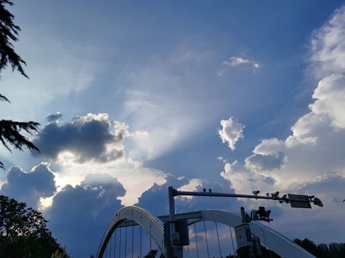Clouds and a bridge against a blue sky