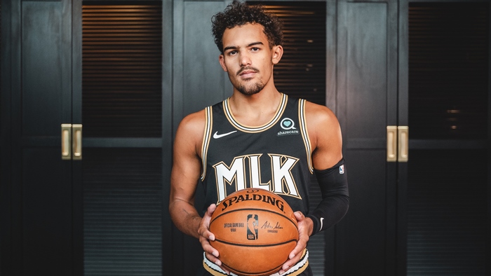 Trae Young of the Atlanta Hawks holding a Spalding basketball