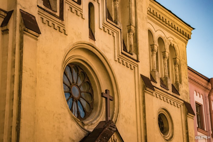 Church facade with rose window and cross