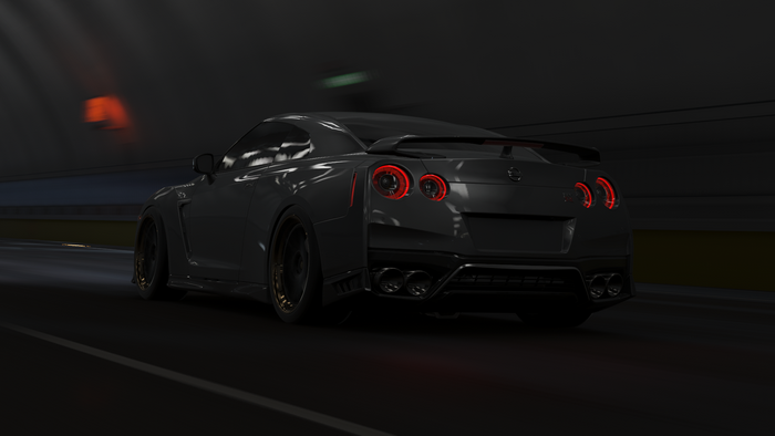 Rear view of a black Nissan GT-R driving in a tunnel