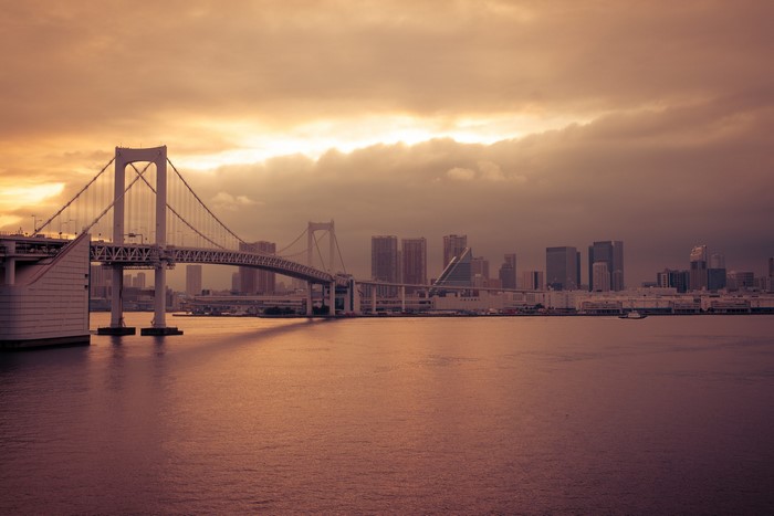 Rainbow Bridge and Tokyo cityscape at sunset
