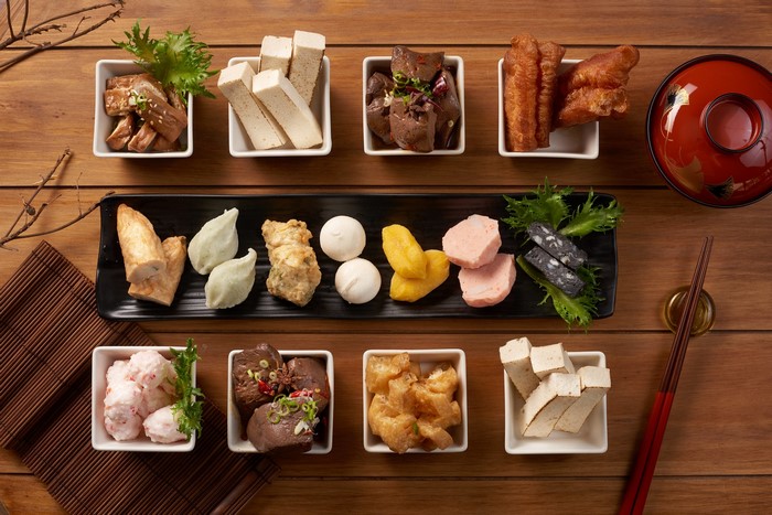 Asian hot pot ingredients on a wooden table