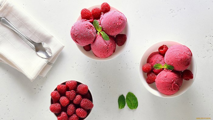 Raspberry ice cream with fresh berries and mint