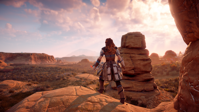 Aloy from Horizon Zero Dawn in a desert landscape