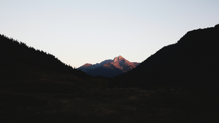 Mountain range at sunset with trees