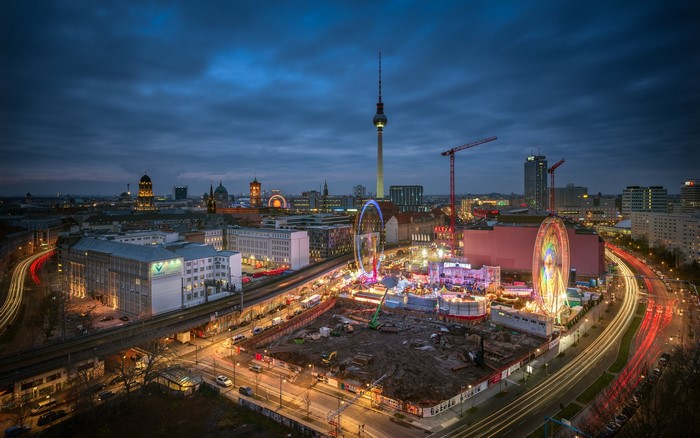 Berlin cityscape at night with Ferris wheel and light trails