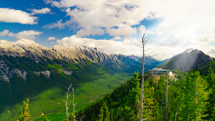 Mountains and valley with a building in Banff National Park, Canada