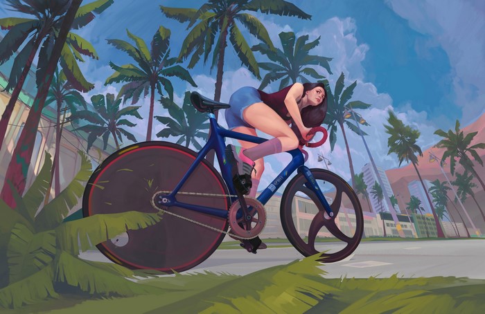 Woman cycling on a track bike with palm trees
