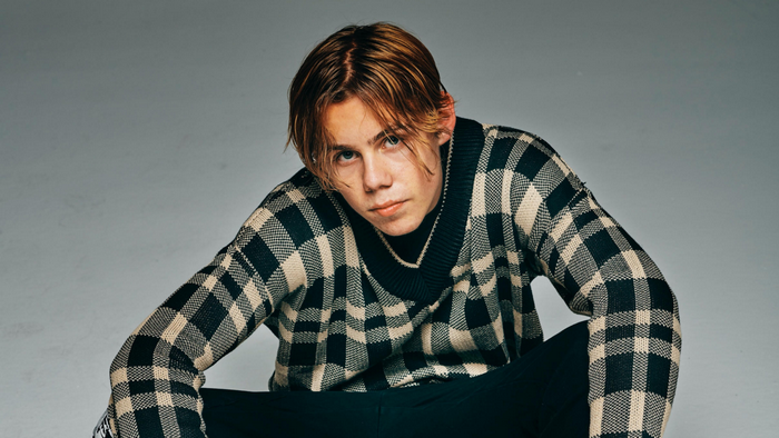 The Kid LAROI in a checkered sweater