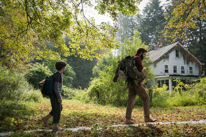Lee Abbott and Marcus Abbott walk near a house